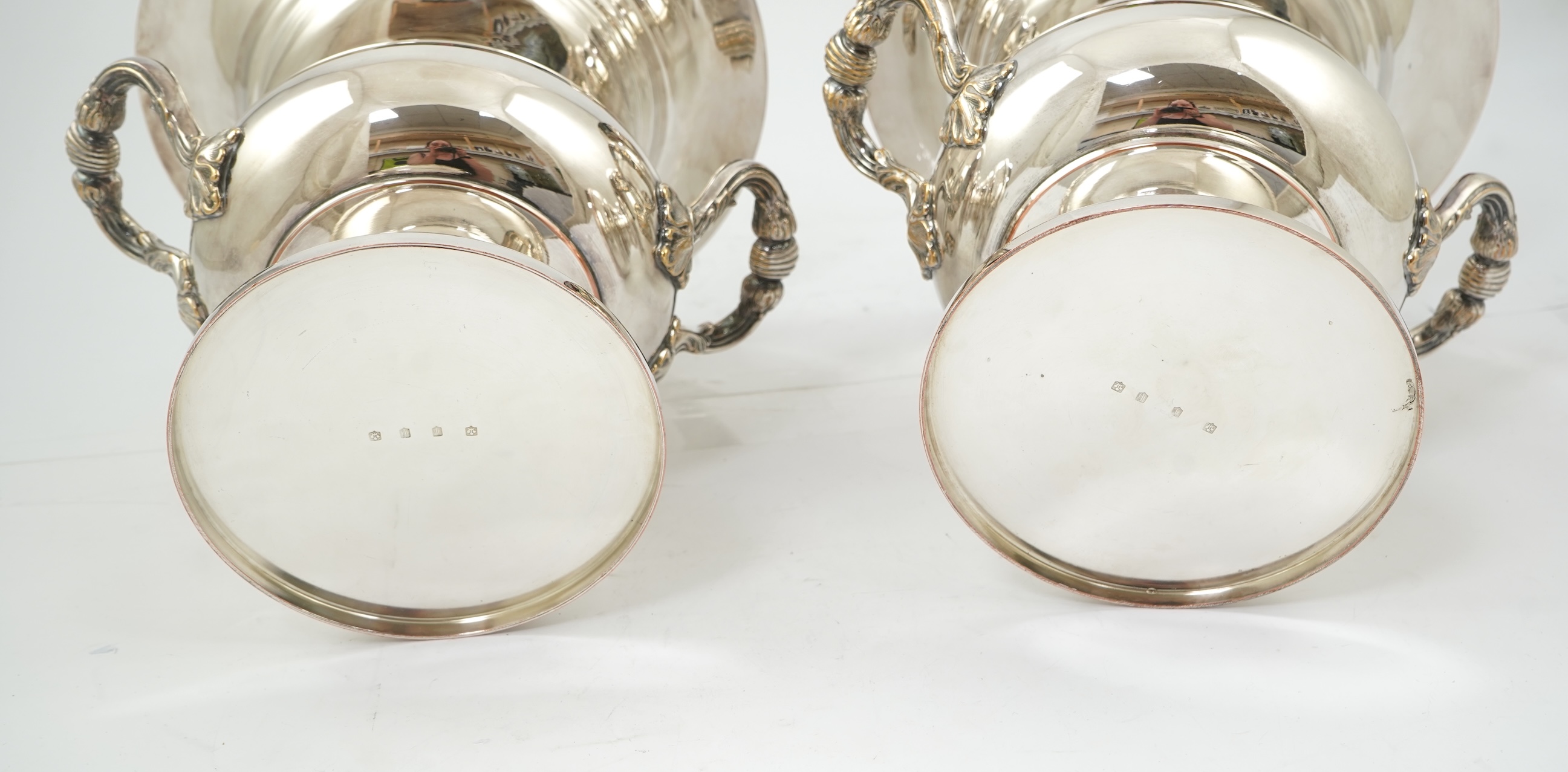 A pair of late 19th/early 20th century silver plated two handled campana shaped wine coolers, makers, FH